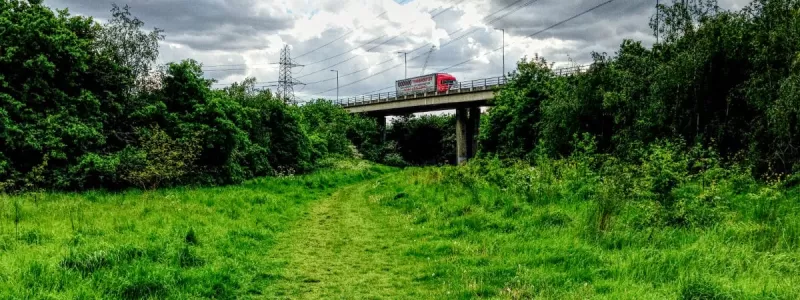 The M11 looms over Roding Valley Park, road design in otherwise pleasant open space that the Layfield Report described as an "environmental disaster". Click to enlarge
