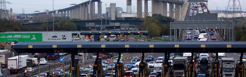 The old toll booths at Dartford, now removed, with their permanent queues. Click to enlarge