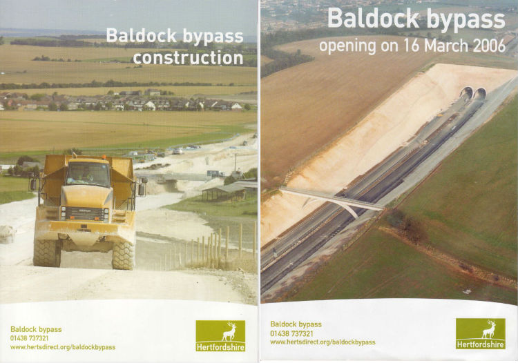 Front covers of two booklets side by side, one on the left titled "Baldock Bypass Construction" with a picture of an earthmoving truck on an unfinished road, and on the right "Baldock Bypass" with an aerial photo of a road passing under an arched bridge