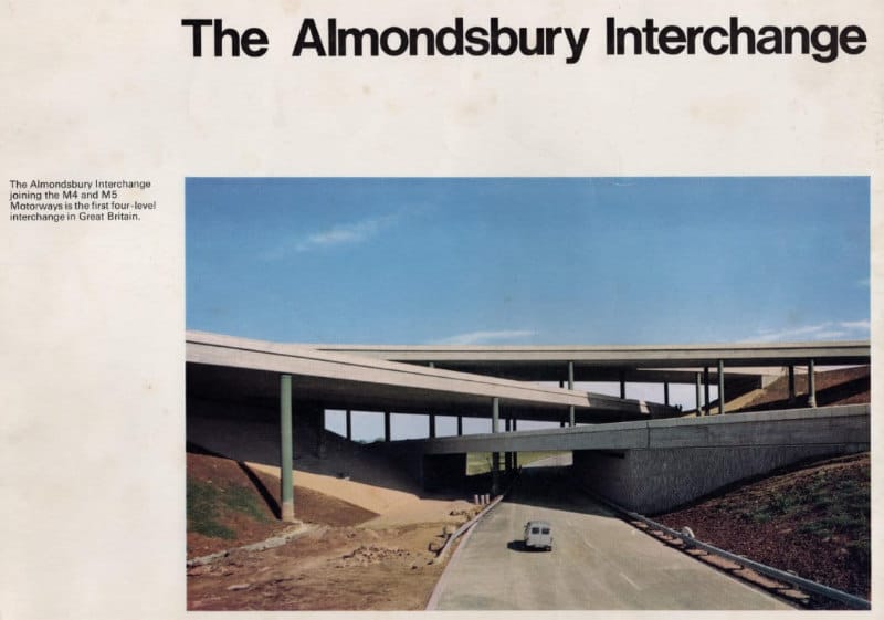 Front cover of a booklet, with the title "The Almondsbury Interchange" and a colour photograph of a four-level motorway junction