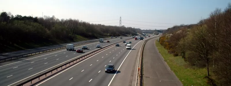 The unused road to Whiteley Services, seen here on the right, with its counterpart in use as the exit for junction 9 on the left. Click to enlarge
