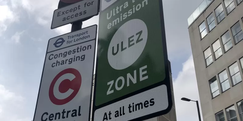 A new sign for the ULEZ, next to an existing Congestion Charge sign. Click to enlarge