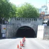 The portal comes complete with a "tunnel" warning sign (to the right), with a continental-style name plate. It reads "Mersey / Queensway / 3240m".