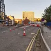 The right-hand exit from Great Crosshall Street is closed to traffic with a scattered line of cones and, beyond them, some plastic barriers. The reason for the road closure isn't very obvious from here.