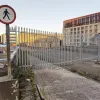 A "no pedestrians" sign stands by the new metal fencing that properly closes the road at the point the flyover began.