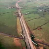 View west from Leeds-Liverpool Canal underbridge to Sandy Lane