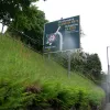 If you hadn't yet picked up the idea that the A470 is not very direct, here comes our next change of direction. At the Give Way sign ahead we turn left — round a 170-degree bend to the road at the top of that bank. Engage low gear now!