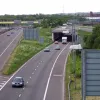 A bit further along the bridge, one of the crossovers is visible. Bridge technology in the late 1960s made very oblique skew crossings difficult and expensive, so instead the crossovers were built as "galleries" — long fake tunnels. As a result, this bridge is 150m long, even though it only exists to allow two lanes of traffic to pass below another two lanes of traffic.