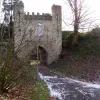 There's also this folly, forming another tunnel, on which is mounted a plaque declaring that it is "to save the memory of William Earl Warren who in old days dwelt here, and was a loyal champion of our liberties from perishing like his own castle by the ravages of time, Richard Barnes at his own expense erected this gateway in the year 1777".