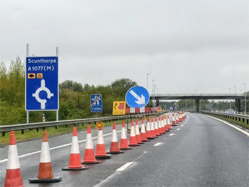 Travelling north on the M181, here's the first sign of change. The old "end of motorway 1 mile" sign is still here but now incorrect. The new sign has no space for other exits, and isn't installed in a way that looks like it was done with much care.